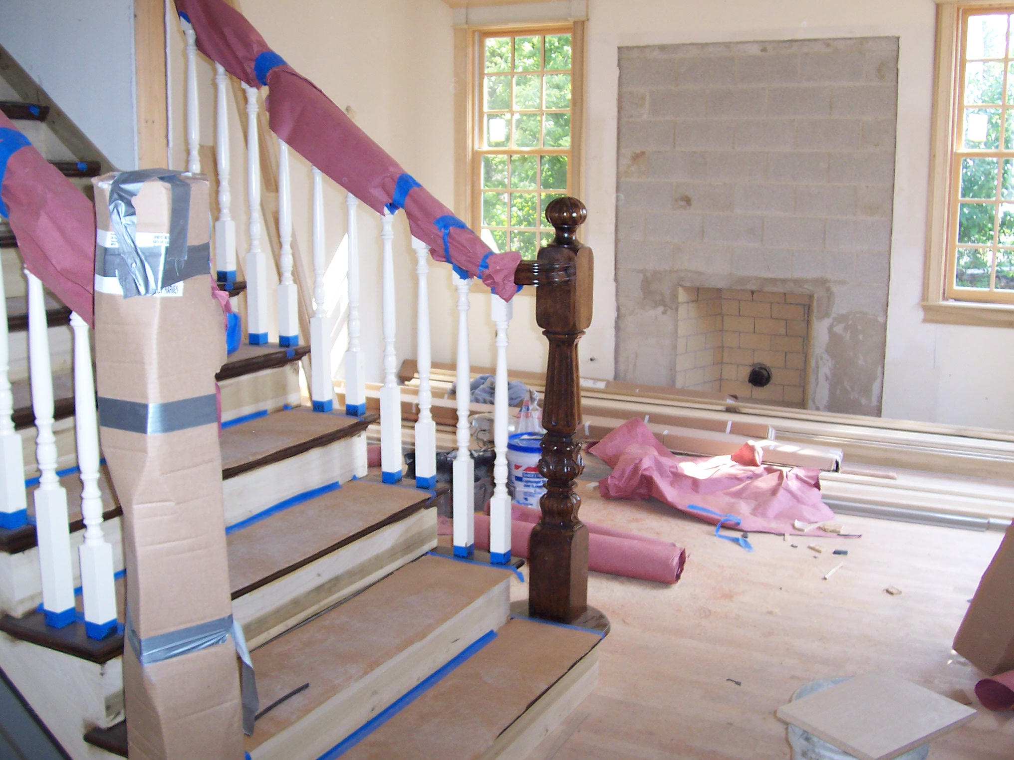 Should painted balusters be installed at the same time as the stair?